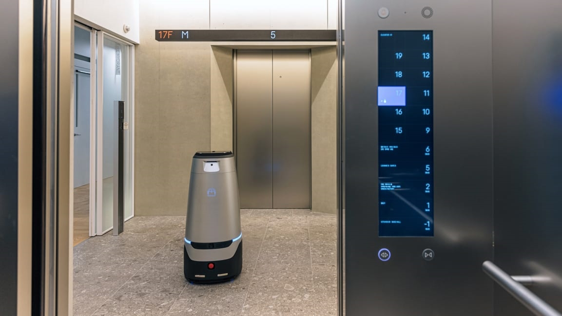 This futuristic office was designed for 5,000 people—and 100 robot coworkers