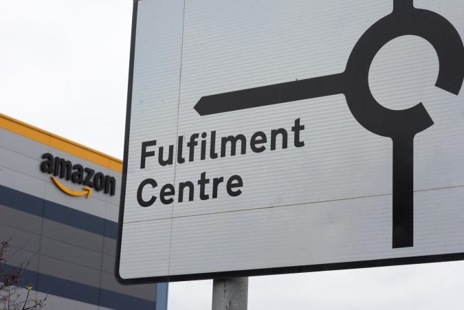 Over 700 UK Amazon workers walk out over pay issues