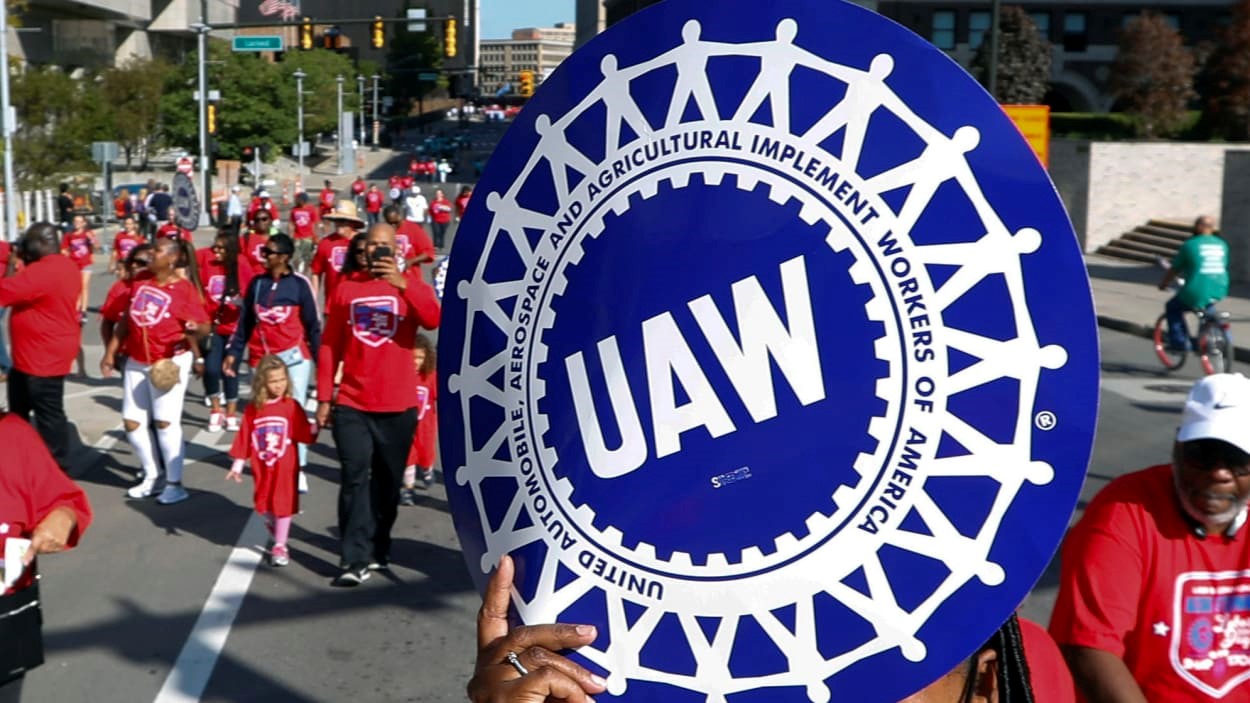 Auto workers vote to authorize strike against General Motors, Ford, and Stellantis