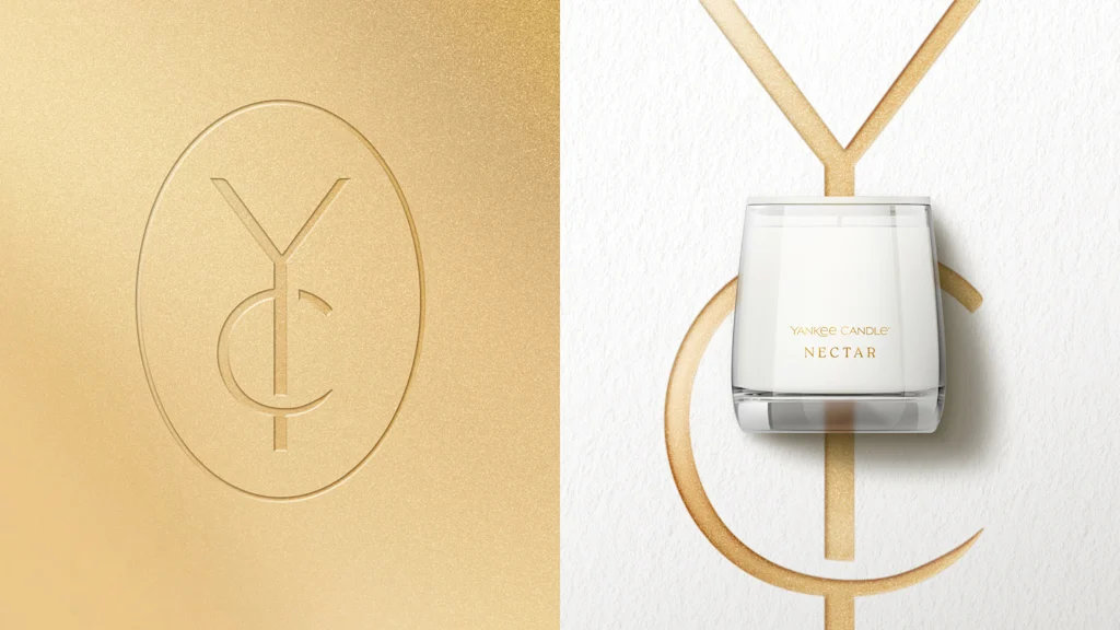Yankee Candle designed a new luxury candle line New Yankee Candle branding, an simple intertwined "Y" and "C" debossed into on a gold background