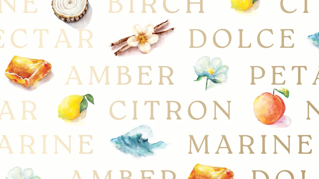 Yankee Candle designed a new luxury candle line a typography specimen showing off the new branding, it's a rounded-serif type, printed in gold-like ink, with watercolor illustrations depicting the scents peach, ocean waves crashing, lemons, wood, vanilla, etc