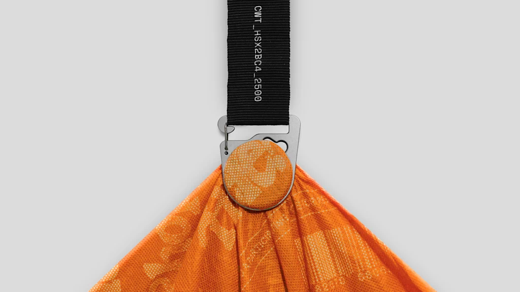 This genius clamp instantly transforms your tote into a crossbody bag